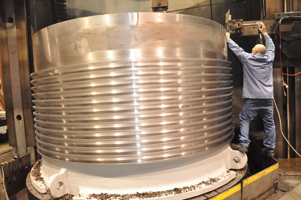 Adjustment bowl threads being machined on our vertical CNC machining center in Prime Machine Shop. Machining threads on adjustment bowl for large cone crusher on our vertical CNC machining center in our machine shop very large complex machining.