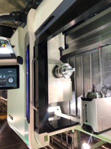 Machining complex pivot arm on multi-axis mill/turn CNC machine.