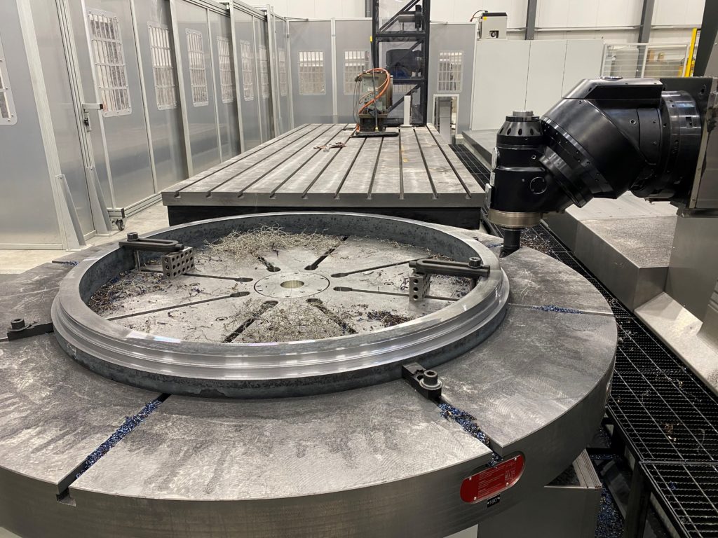 Machine Shop with large horizontal machines. Mill-turning aerospace ring on Parpas horizontal boring machine with turn table. The Parpas is a large volume machine with 5-axis capabilities one many large capability machines in our machine shop.